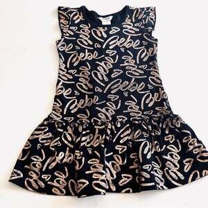 Bebe girls black jersey dress with gold Bebe words throughout size 4